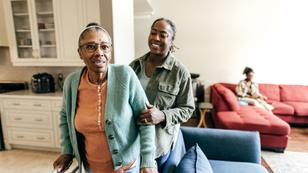 A Black woman cares for her mother at home, photo by kate_sept2004/Getty Images